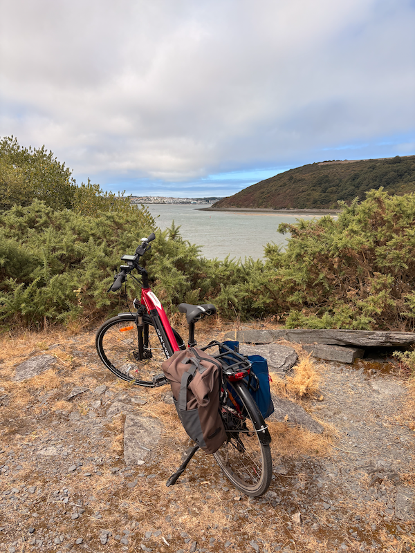 My bike with a view of the Camel Estuary and Padstow in the distance