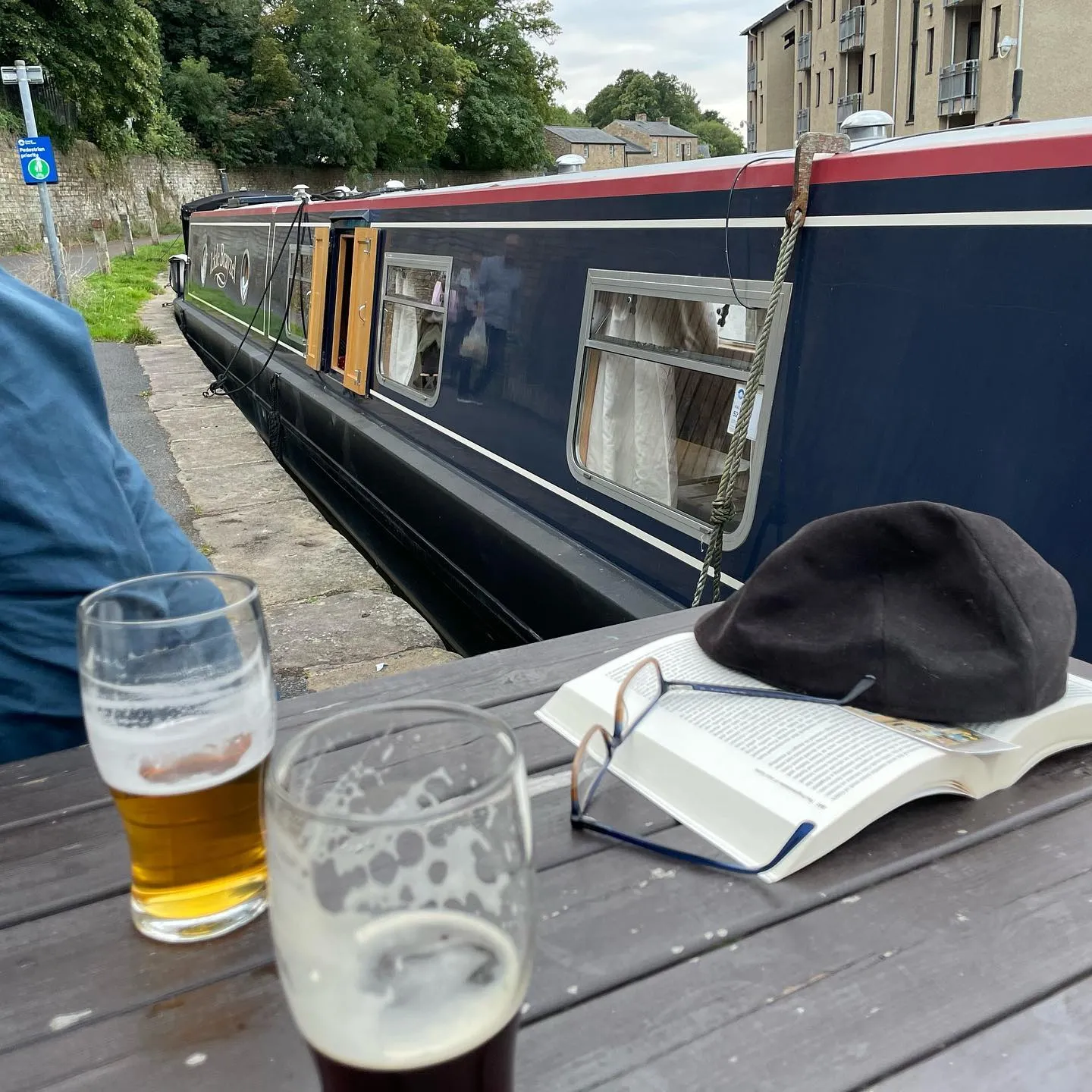Boat moored next to the beer garden