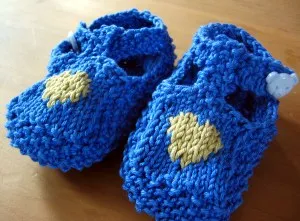 close up of heart baby shoes